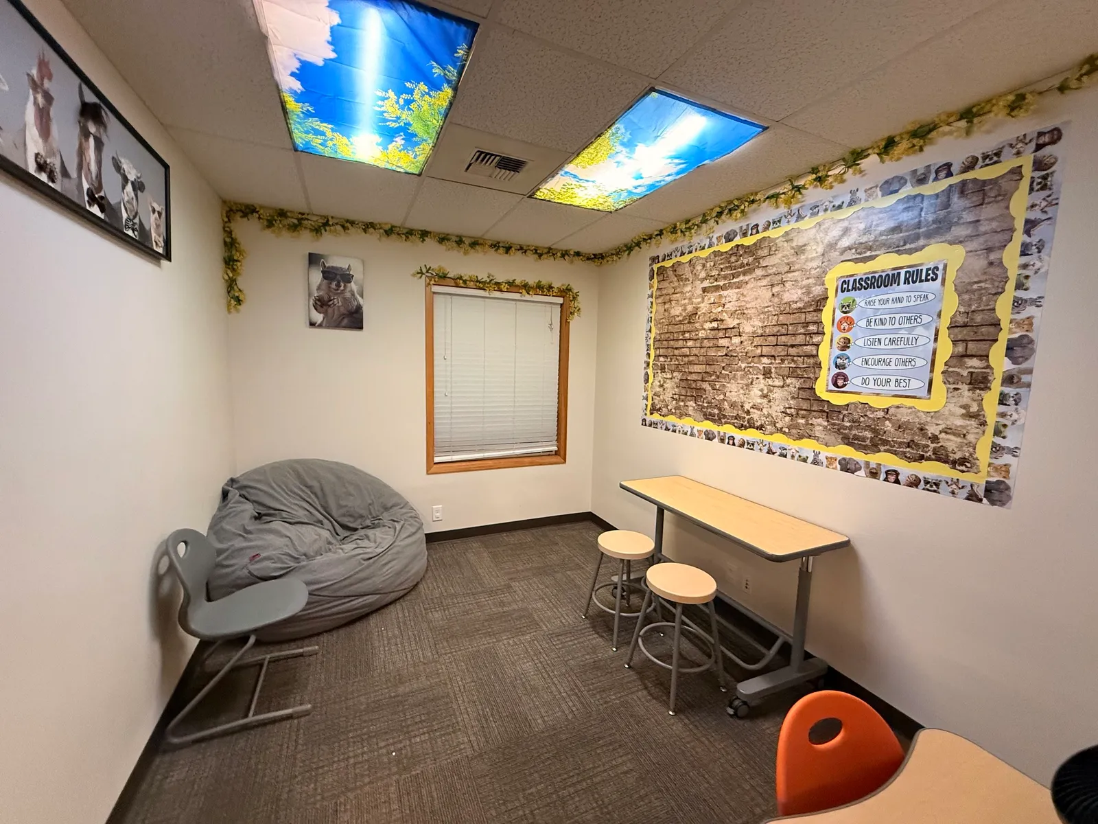 Activity room at Maple Street Academy in Issaquah with classroom furniture and animal-themed learning decor.