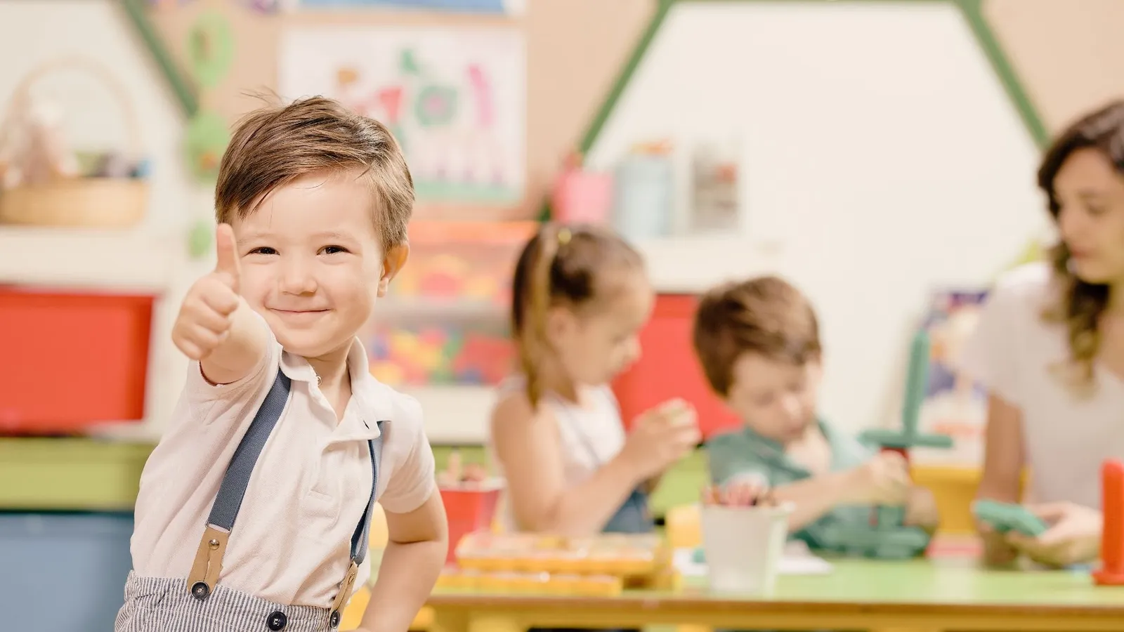 A young child engaged in an early intervention learning activity at Orchid Academy.