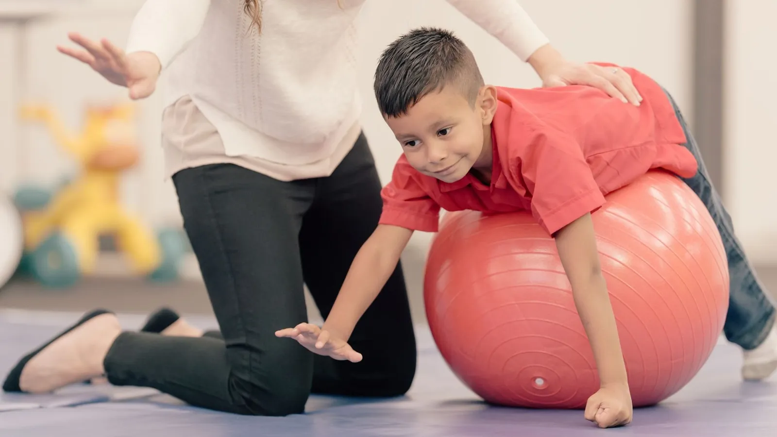 A child engaged in an occupational and speech therapy session at Orchid Academy.
